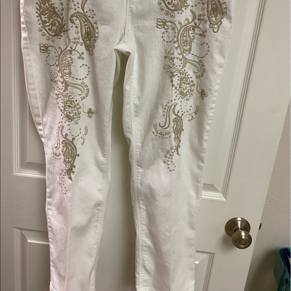 So slimming by Chicos.  Size 2. white jeans